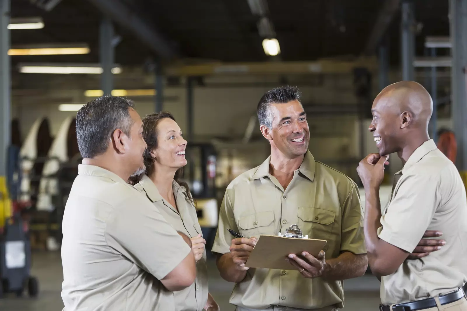 Group of employees meeting in a warehouse