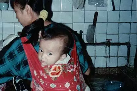 An AAPI U Krewer shown as a baby with his Chinese mother 