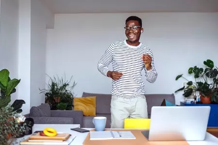 Employee dancing while working from home