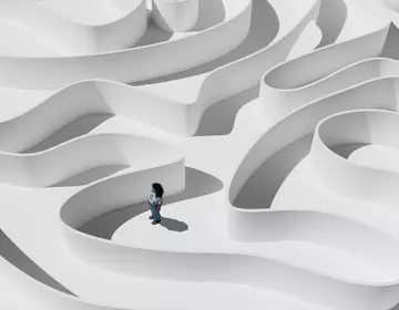 An animated person standing in a maze. 